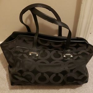 Black coach pattern purse.